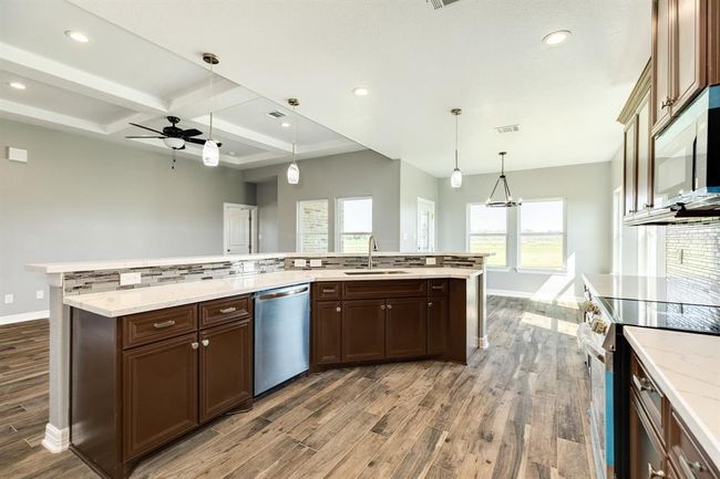 Island with a Sink and Dishwasher | Image 11