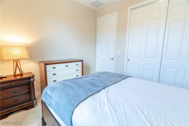 Bedroom with a closet, carpet, and visible vents | Image 21