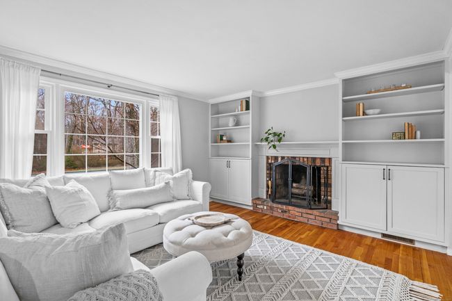Built in bookshelves and wood burning fireplace | Image 9