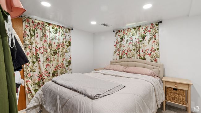 Bedroom featuring recessed lighting and visible vents | Image 17