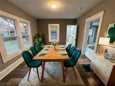 Kitchen featuring new gray cabinetry, granite counters, subway tile backsplash, new stainless steel appliances and ceramic tile floors. | Image 3