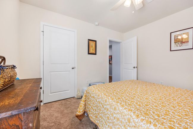 Bedroom featuring carpet, baseboards, and a ceiling fan | Image 10