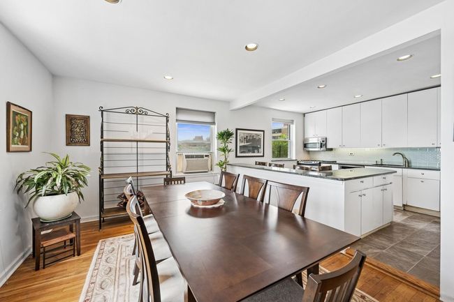 Dining area with recessed lighting, light wood-style floors, baseboards, and cooling unit | Image 9