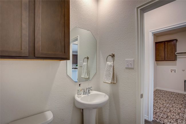 Downstairs half bath and utility room | Image 18