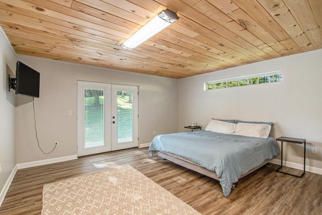 Main floor Primary Bedroom with walk in closet | Image 19