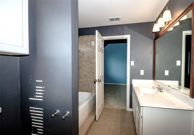 Bathroom featuring tile patterned floors, vanity, and baseboards | Image 17