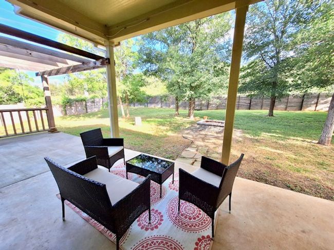 View of patio with a fenced backyard and an outdoor living space | Image 21