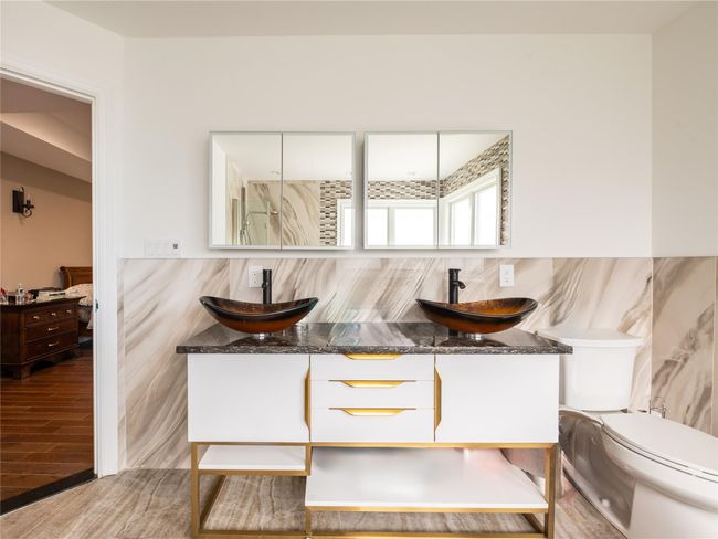 Dining room featuring wood finished floors and tile walls | Image 19