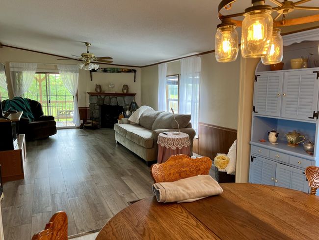 Living room with sliding glass doors lead to your covered patio. | Image 14