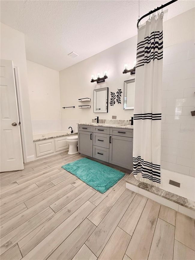Primary Bath with extra large Spa Shaped separate bath and Shower | Image 19