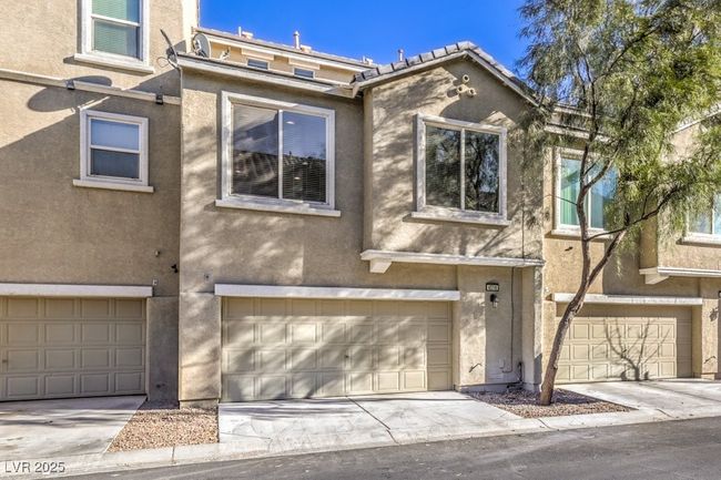 Multi unit property featuring stucco siding, an attached garage, and driveway | Image 37