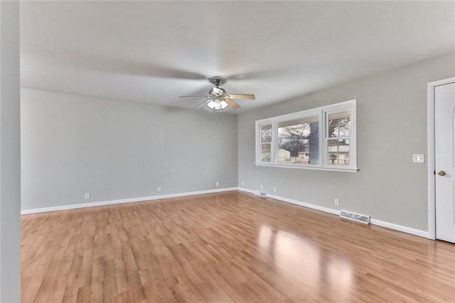 Empty room featuring light hardwood / wood-style flooring and ceiling fan | Image 10