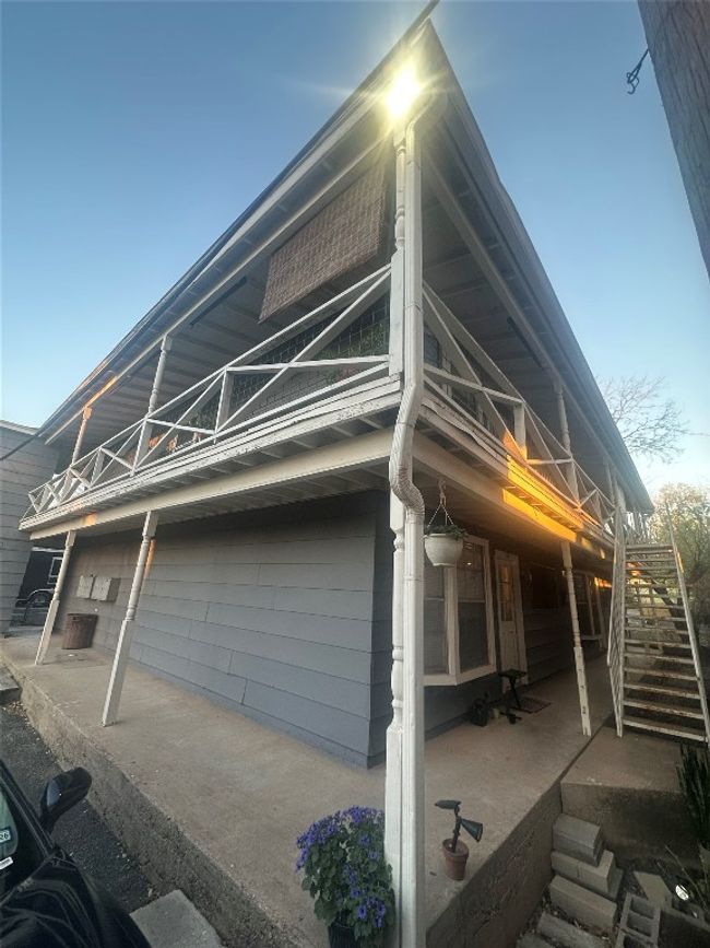 View of side of home with a balcony and stairs | Image 9