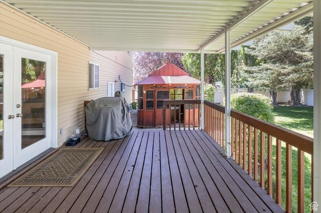 Wooden deck featuring french doors, and a gazebo | Image 38