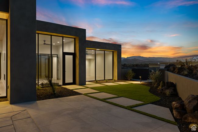 Exterior space with a fenced backyard, a mountain view, and a patio area | Image 11