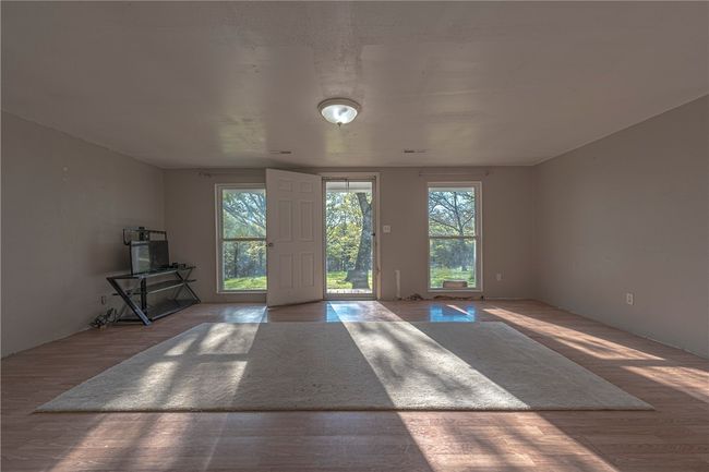 House has great natural light and full windows in the living room | Image 4