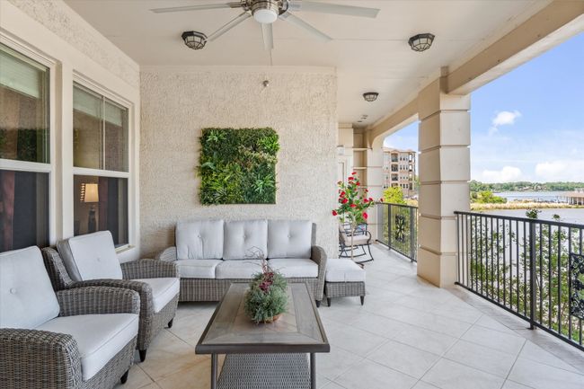 Balcony with ceiling fan and an outdoor hangout area | Image 24