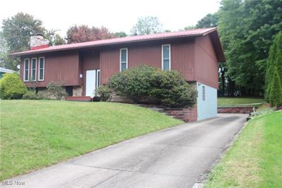 Raised ranch featuring a front yard | Image 1