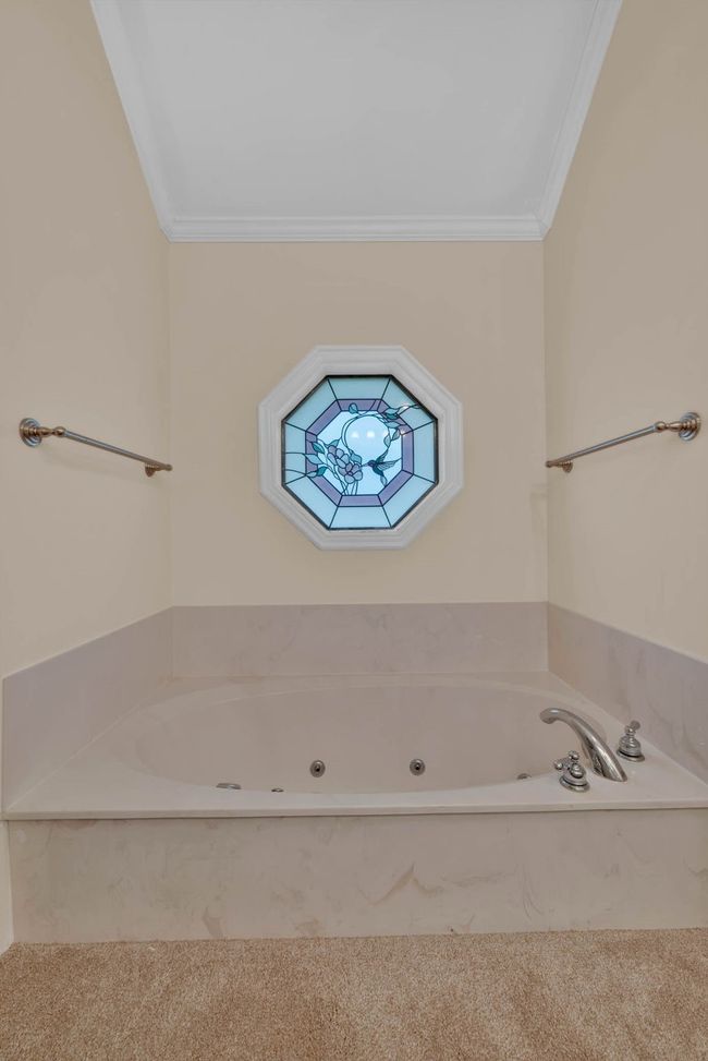 Bathroom with crown molding and a jetted tub | Image 20