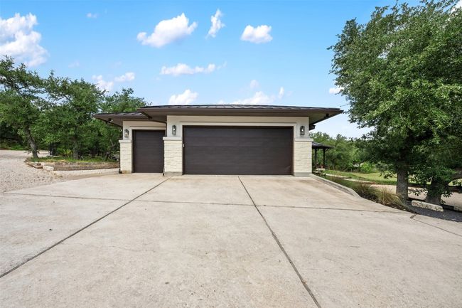 2.5 car garage and plenty of paved parking areas | Image 36