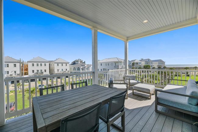 Covered porch features Azek decking and shiplap ceiling. | Image 10