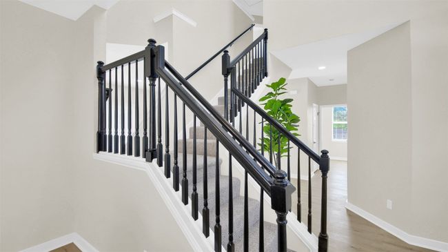 Stairs with wood finished floors and baseboards | Image 13