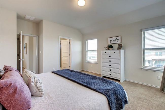 Bedroom featuring carpet floors and vaulted ceiling | Image 19