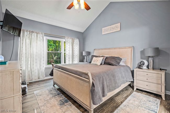 Bedroom featuring high vaulted ceiling, hardwood / wood-style flooring, and ceiling fan | Image 18