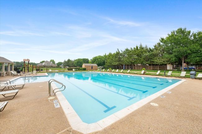 Community pool with a patio area | Image 37