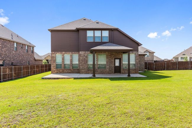 Back of house featuring a patio area, a fenced backyard, brick siding, and a shingled roof | Image 24
