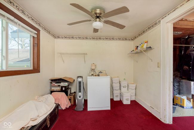 interior space featuring washer and clothes dryer, ceiling fan, laundry area, and baseboards | Image 29