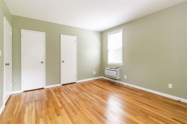 Another angle of the primary bedroom showing 2 closets | Image 6