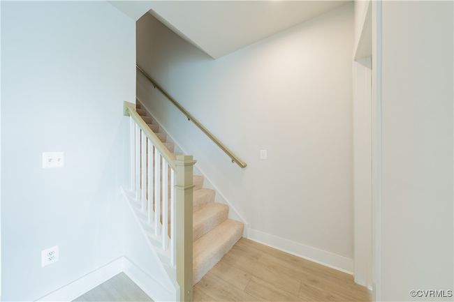Stairs with wood finished floors and baseboards | Image 24