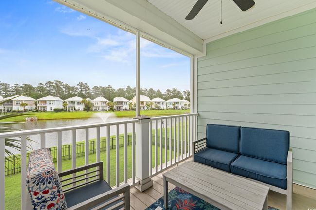 Screened in upper deck off of the dining area featuring a water view. | Image 29