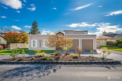 Circular driveway leads to double door entrance | Image 3