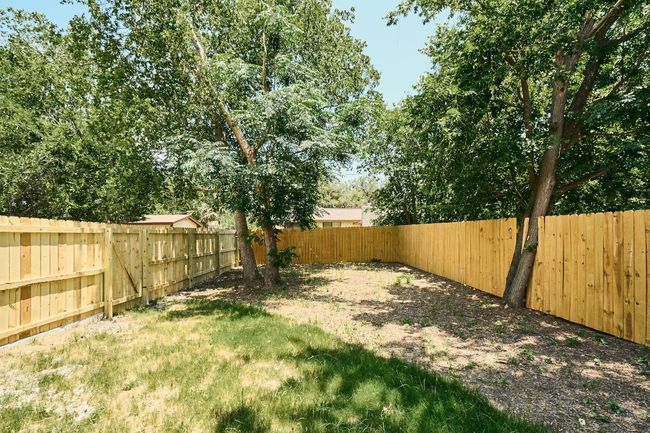 View of fenced backyard | Image 4