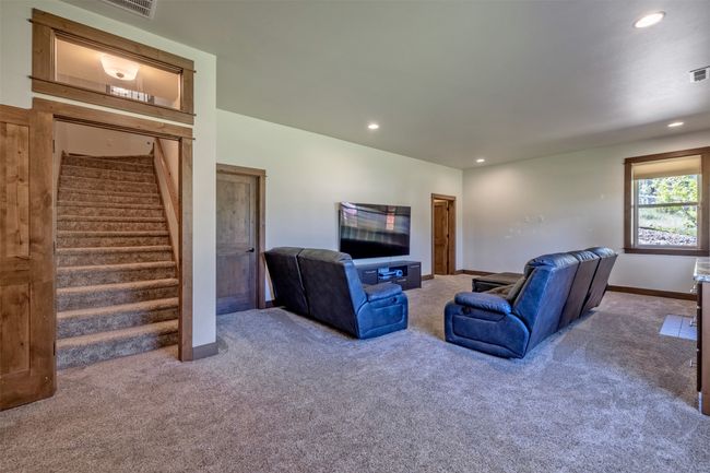Living room featuring carpet, stairs, recessed lighting, and baseboards | Image 31