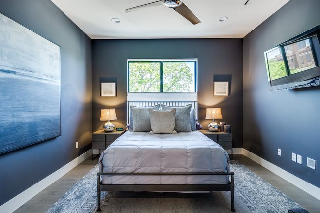 Bedroom with baseboards, wood finished floors, and multiple windows | Image 19