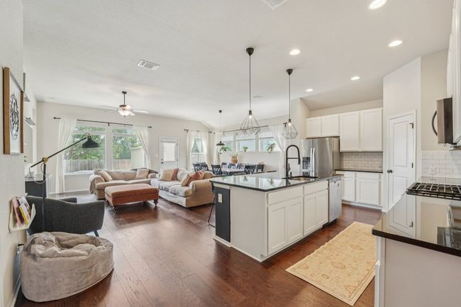 Notice the dark, rich wood floors throughout | Image 8