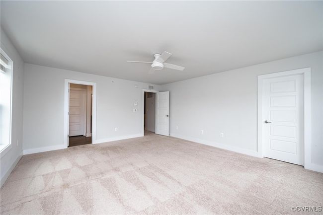bedroom with carpet floors and a ceiling fan | Image 14