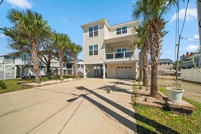 View of front of house with a carport and a balcony | Image 3