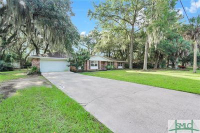 All brick 4 bed, 2 bath with 2 car garage on large lot! | Image 2