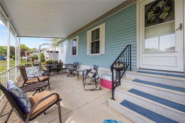 View of patio with outdoor dining space | Image 7