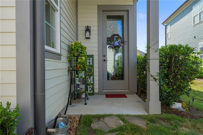Covered back door which is wonderful for landing. Glass door lets in lots of light. | Image 8