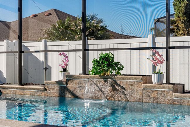 Enjoy the relaxing sound of the pool waterfall. | Image 30