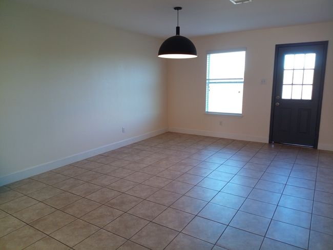 Entrance foyer with light tile patterned floors and baseboards | Image 9