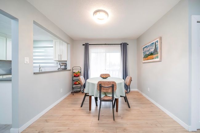 Dining area featuring light wood finished floors and baseboards | Image 18