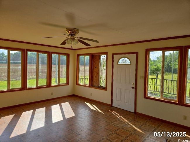 Foyer entrance with ceiling fan and baseboards | Image 26