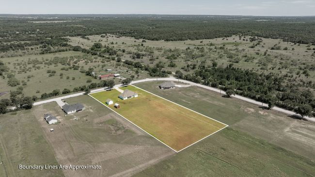 Aerial view of sparsely populated area featuring property parcel outlined | Image 31