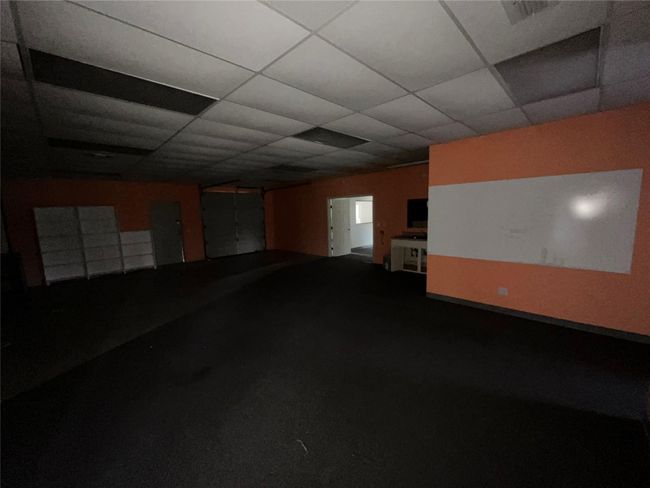 Basement featuring a paneled ceiling and carpet | Image 14